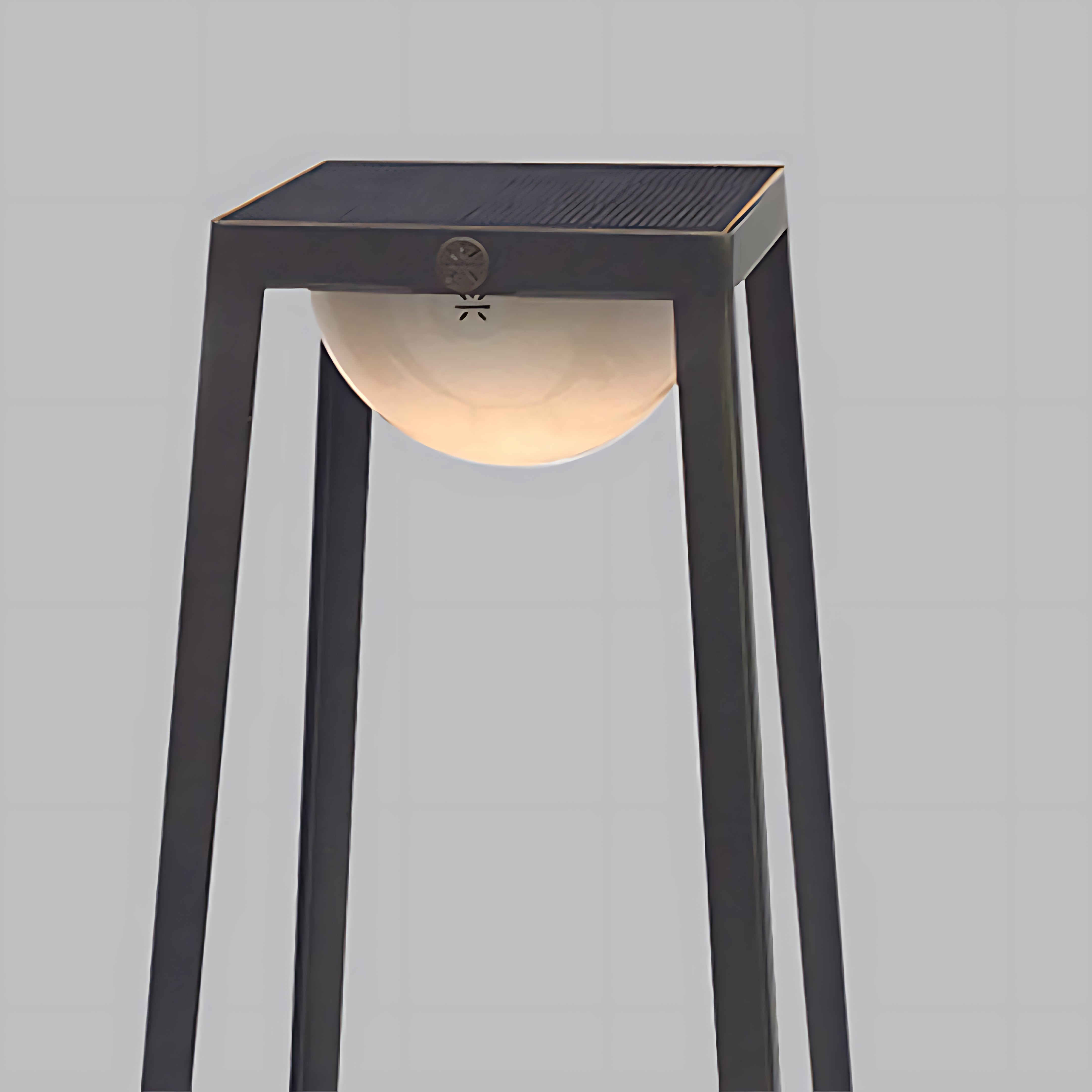 Modern tower lantern with integrated LED light source creating soft downward illumination