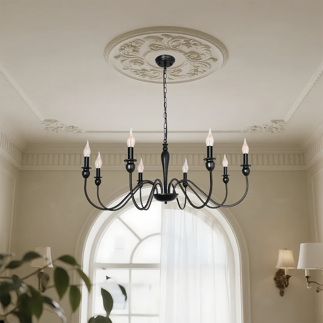 Traditional black candle chandelier with multiple candle lights creating warm illumination in elegant interior