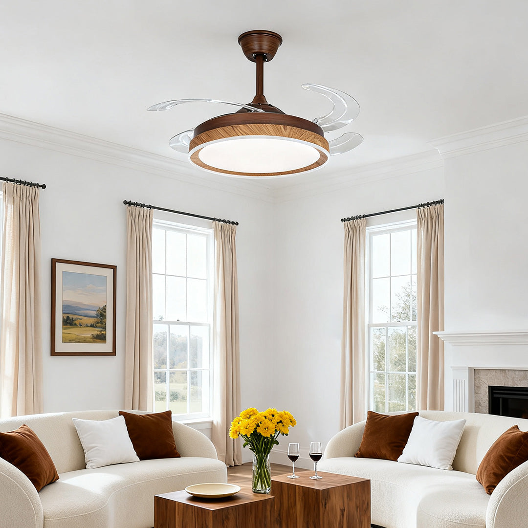 Traditional bronze ceiling fan with 4 lights and retractable blades over a white sofa 