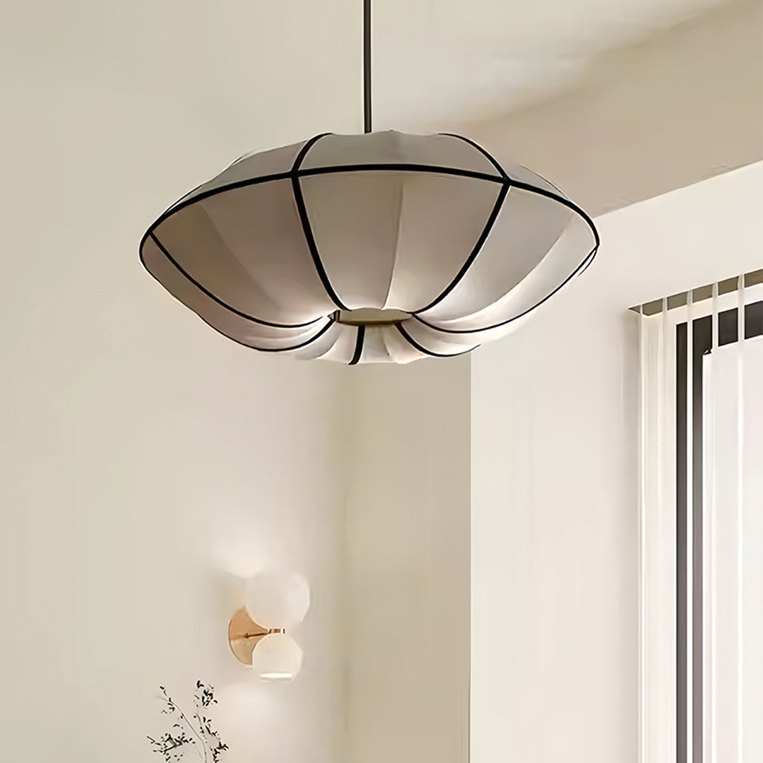 Traditional fabric shade pendant light installed in classic home interior with warm lighting