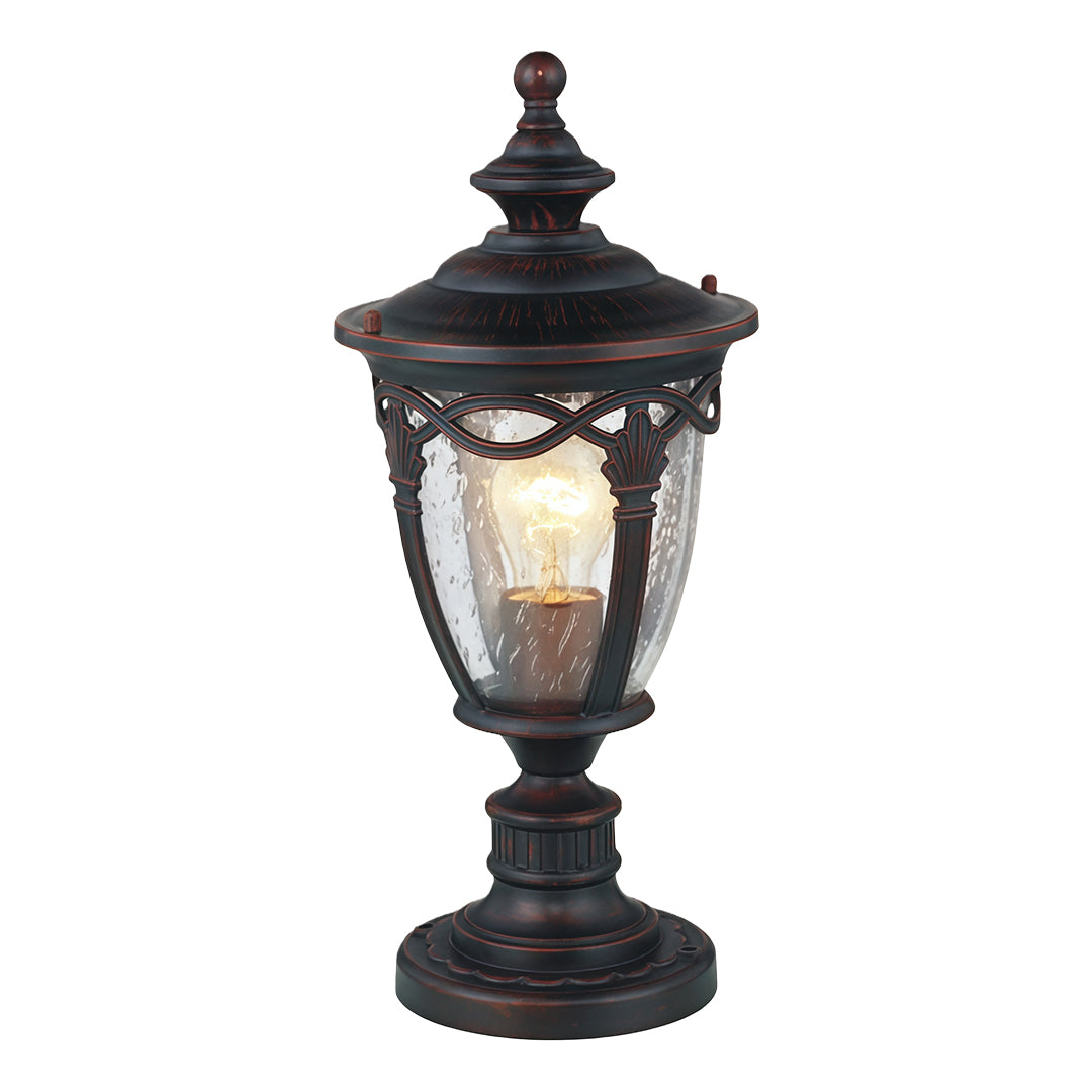 Traditional gate pillar light featuring ornate metalwork and frosted glass on white background