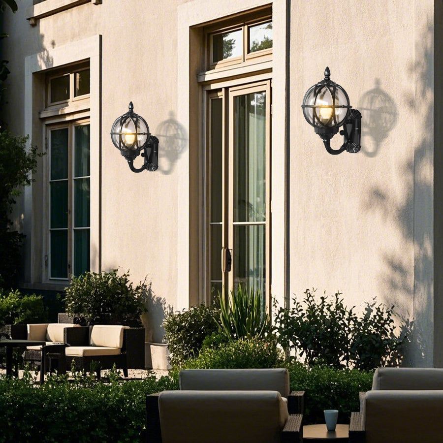 Multiple traditional outdoor lanterns mounted on modern residential building entrance