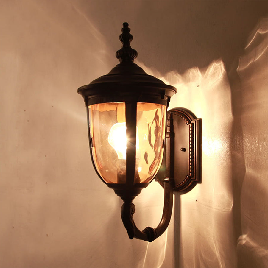 Pair of traditional outdoor lanterns casting warm light on residential building facade