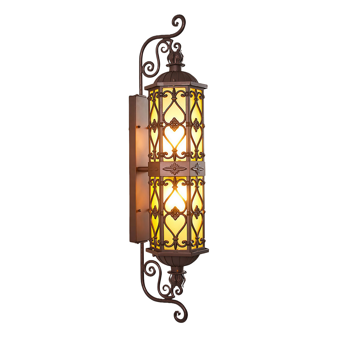 Traditional LED outdoor wall light with detailed metal design mounted along a garden path.