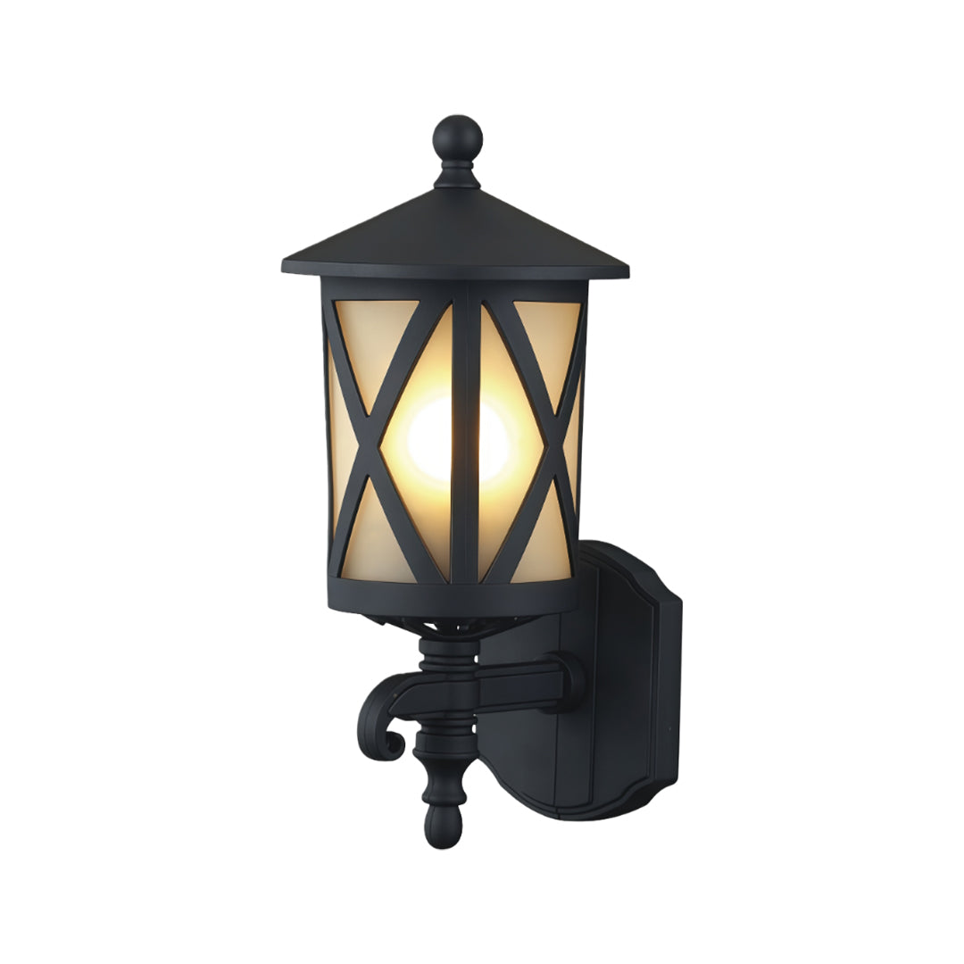 Traditional outdoor black wall light featuring crisscross frosted glass and ornate metal bracket on white background
