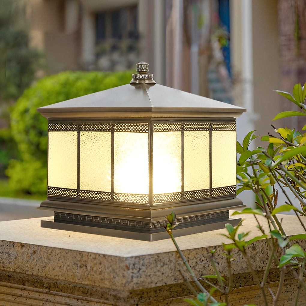 Traditional style outdoor pillar light enhancing curb appeal at a home entrance gate.