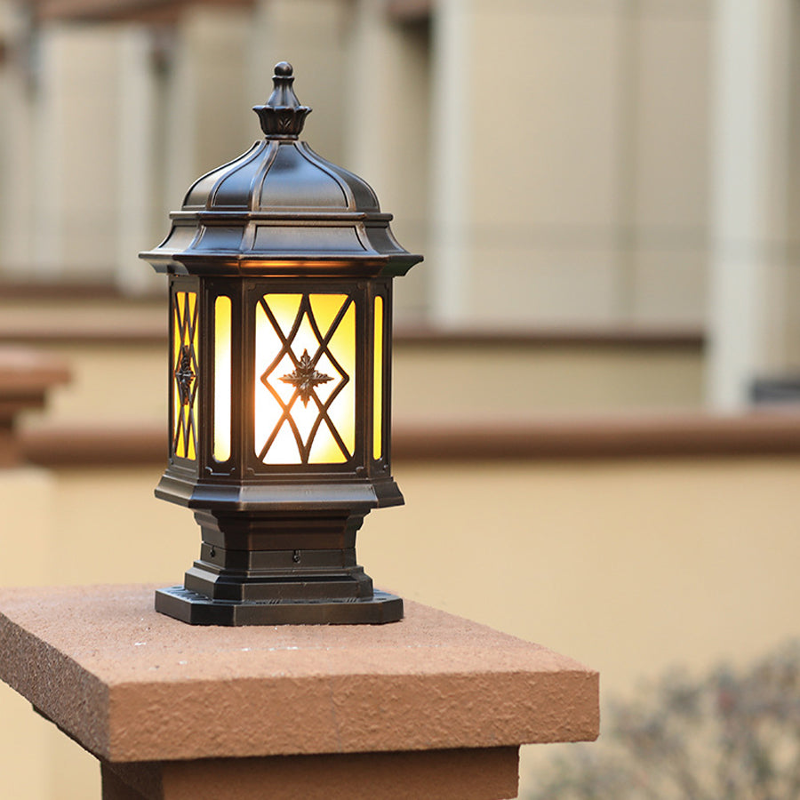 Traditional outside pillar lights with lattice glass design installed on wooden posts for classic outdoor lighting