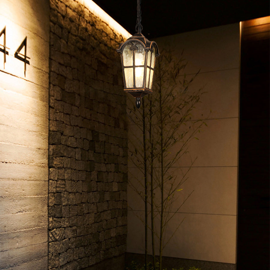 Traditional hanging pendant light with amber glow in rustic stone interior