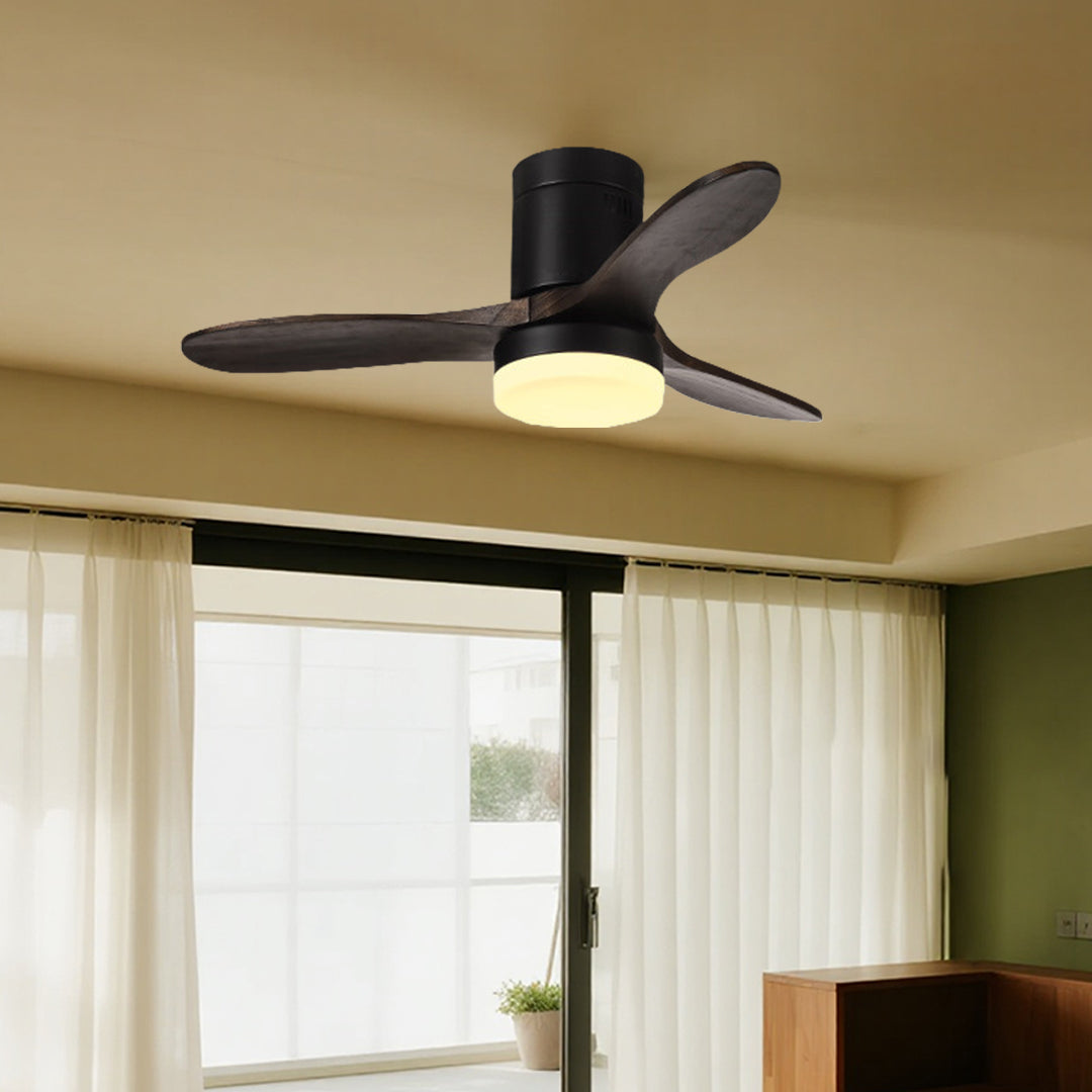 Traditional three blade wooden ceiling fan with light in cozy home setting with natural lighting