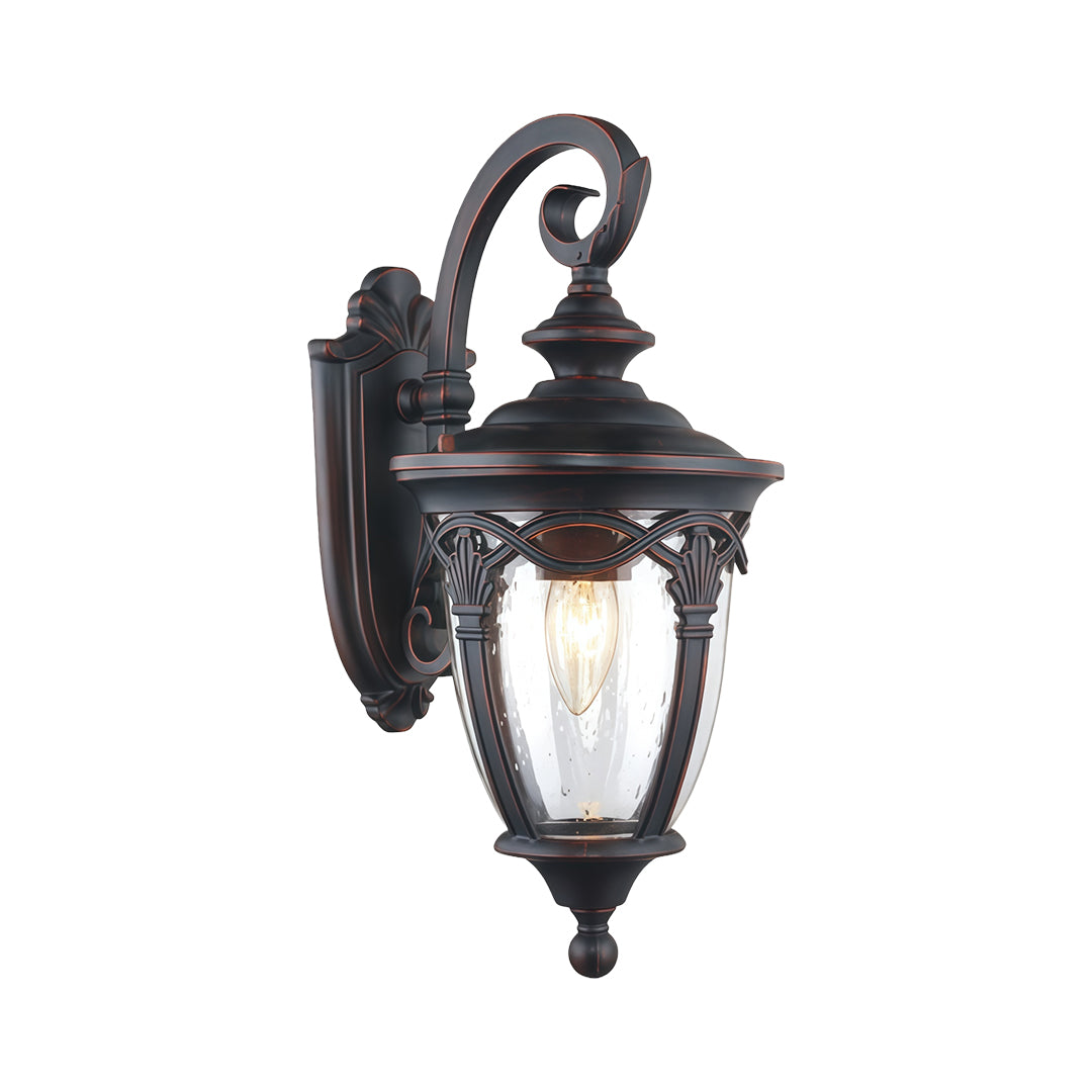 Traditional unique outdoor sconce featuring decorative curved arm and frosted glass on white background