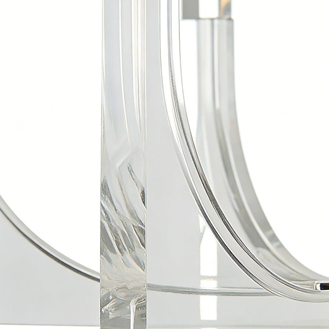 Close up of acrylic retro chandeliers showcasing curved transparent acrylic arms with modern, minimalist lighting design.
