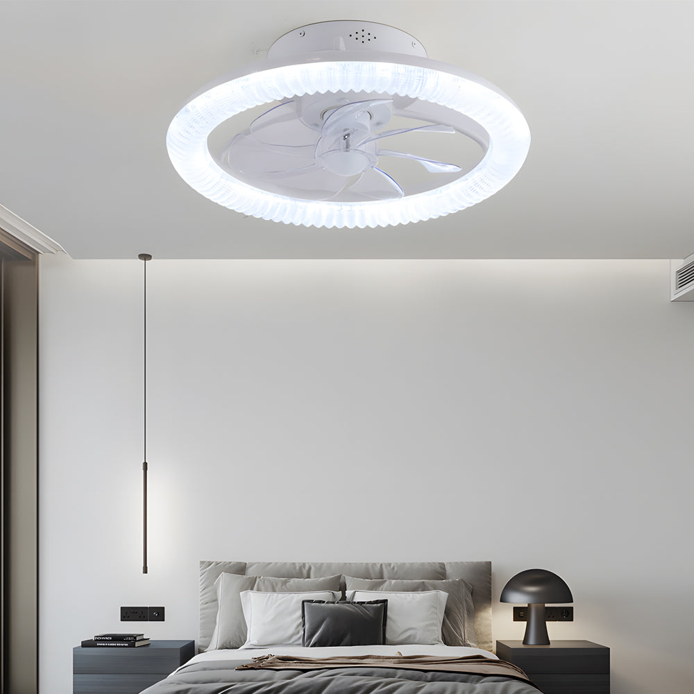 Transparent blade ceiling fan with light, providing ambient lighting in a modern bedroom.