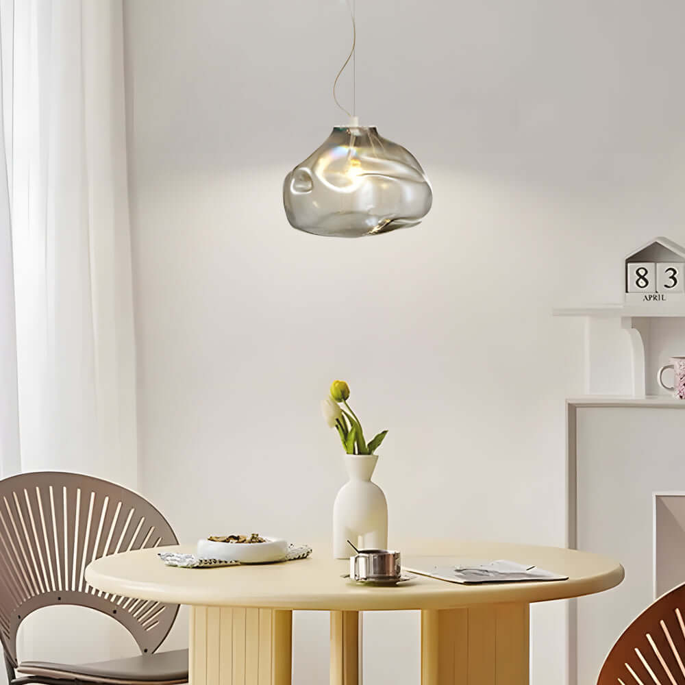 The Transparent Glass Pendant Light features Nordic-inspired hand-blown textured glass, delivering elegant illumination and a modern, minimalist touch to any living space.