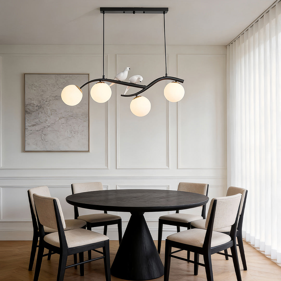 Tree branch style pendant light installed in modern dining room.
