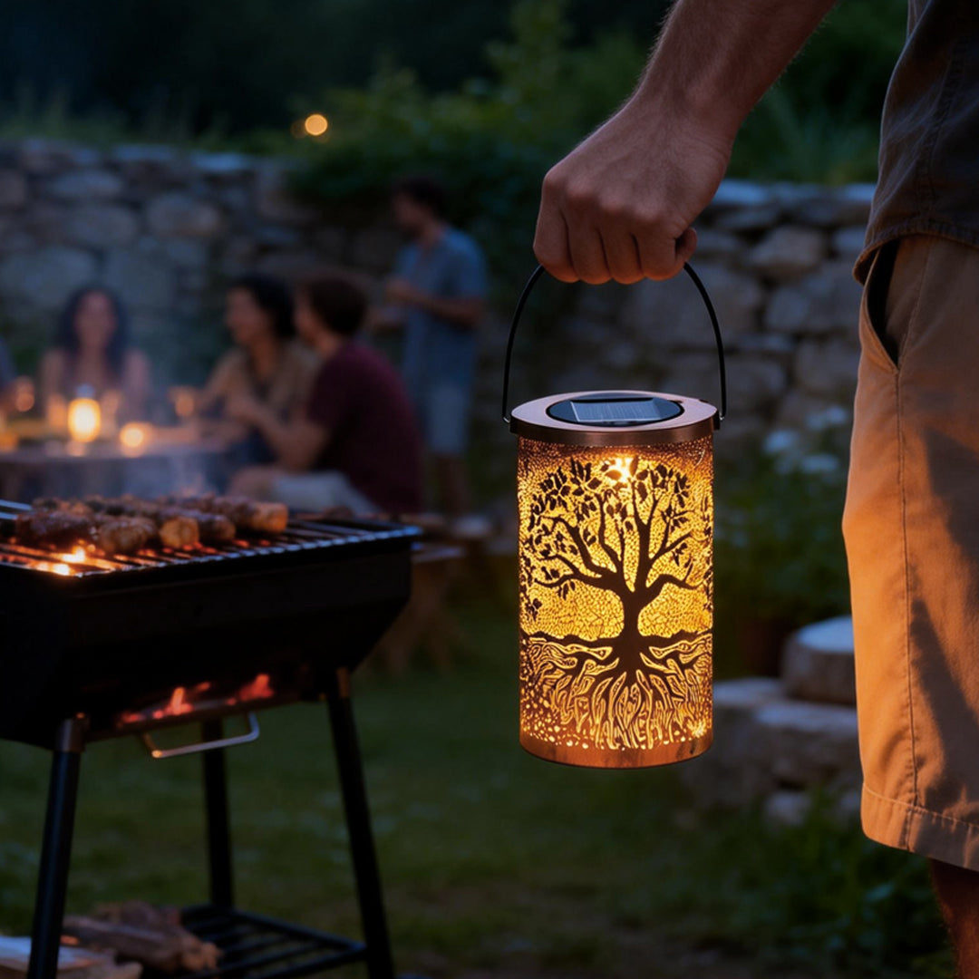 Tree of life lantern providing soft light during an evening barbecue.