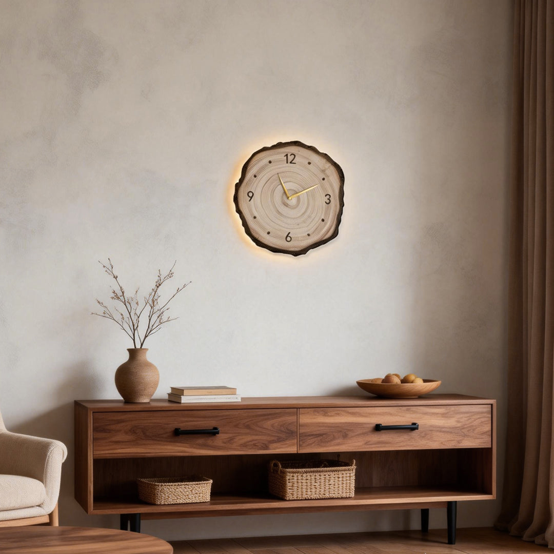 Elegant tree stump wall clock, featuring a natural wooden texture with glowing accents and simple gold clock hands.