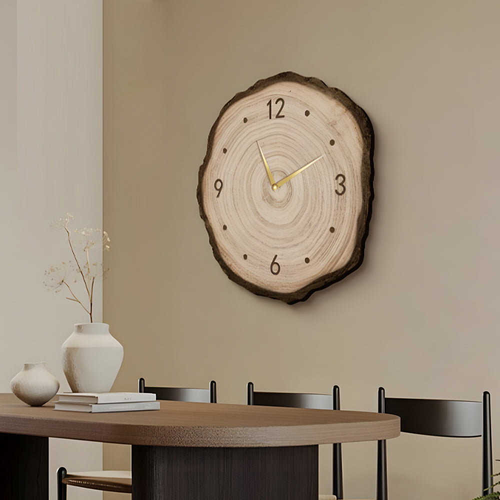 Close-up view of a tree stump wall clock showcasing the natural wood grain pattern and elegant golden hour markers.