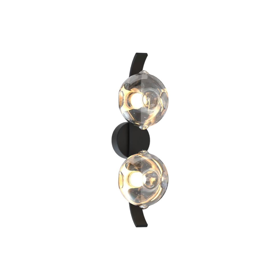 Three-light glass wall sconce in a vertical modern arrangement.