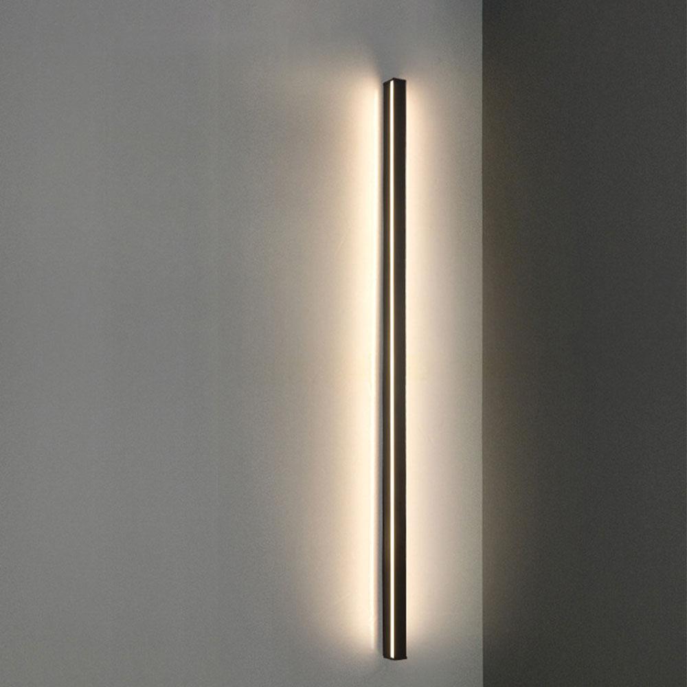 Triple horizontal linear outdoor wall sconce, providing bright and even lighting in a modern living room setting.