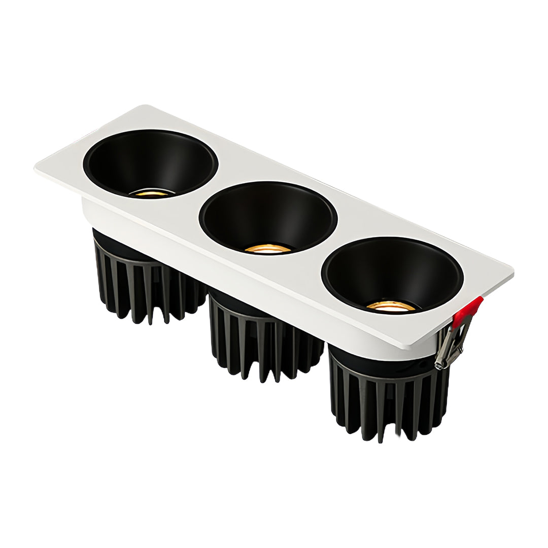 Sleek triple square recessed downlight with black interior and white frame