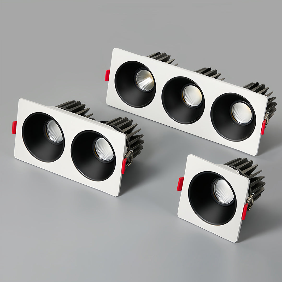 Triple square recessed downlight with black interior and white frame, side view
