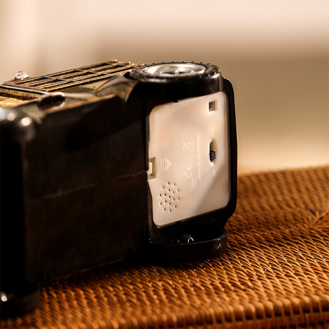 Close-up of the truck decor’s frosted rear window, illuminated with a soft modern gold table lamp warmth.