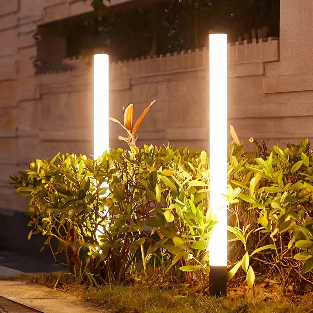 Tube landscape light near plants, highlighting the natural beauty with focused illumination.