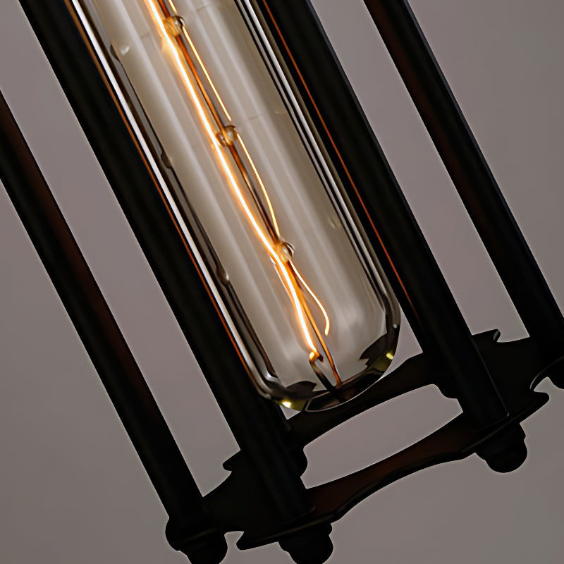 Close-up of a tube pendant light showcasing its black metal and glass details.