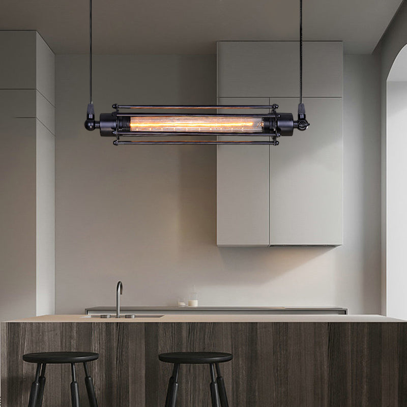 Tube pendant light with an industrial design, hanging in a minimalist kitchen.