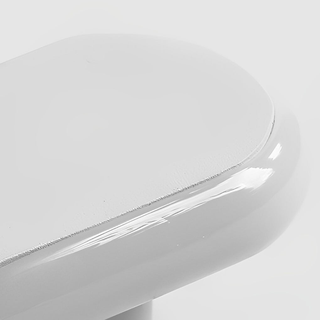 Twisted LED wall lights with a white finish, providing ambient lighting in a living room.