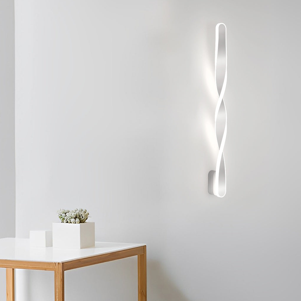 Twisted LED wall lights with a white finish, providing focused lighting in a bedroom.