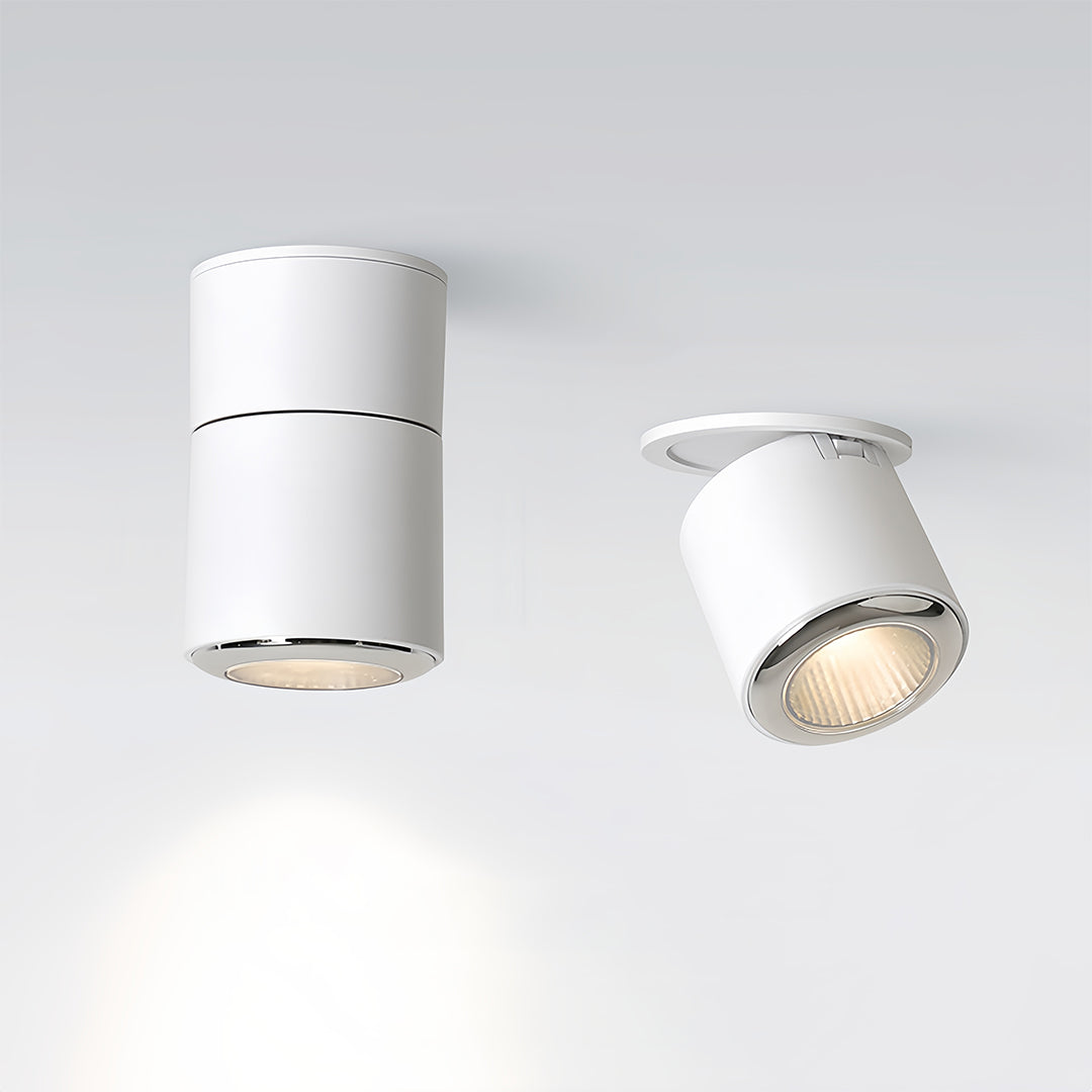 Two adjustable spotlights in white showing different angles and warm light output