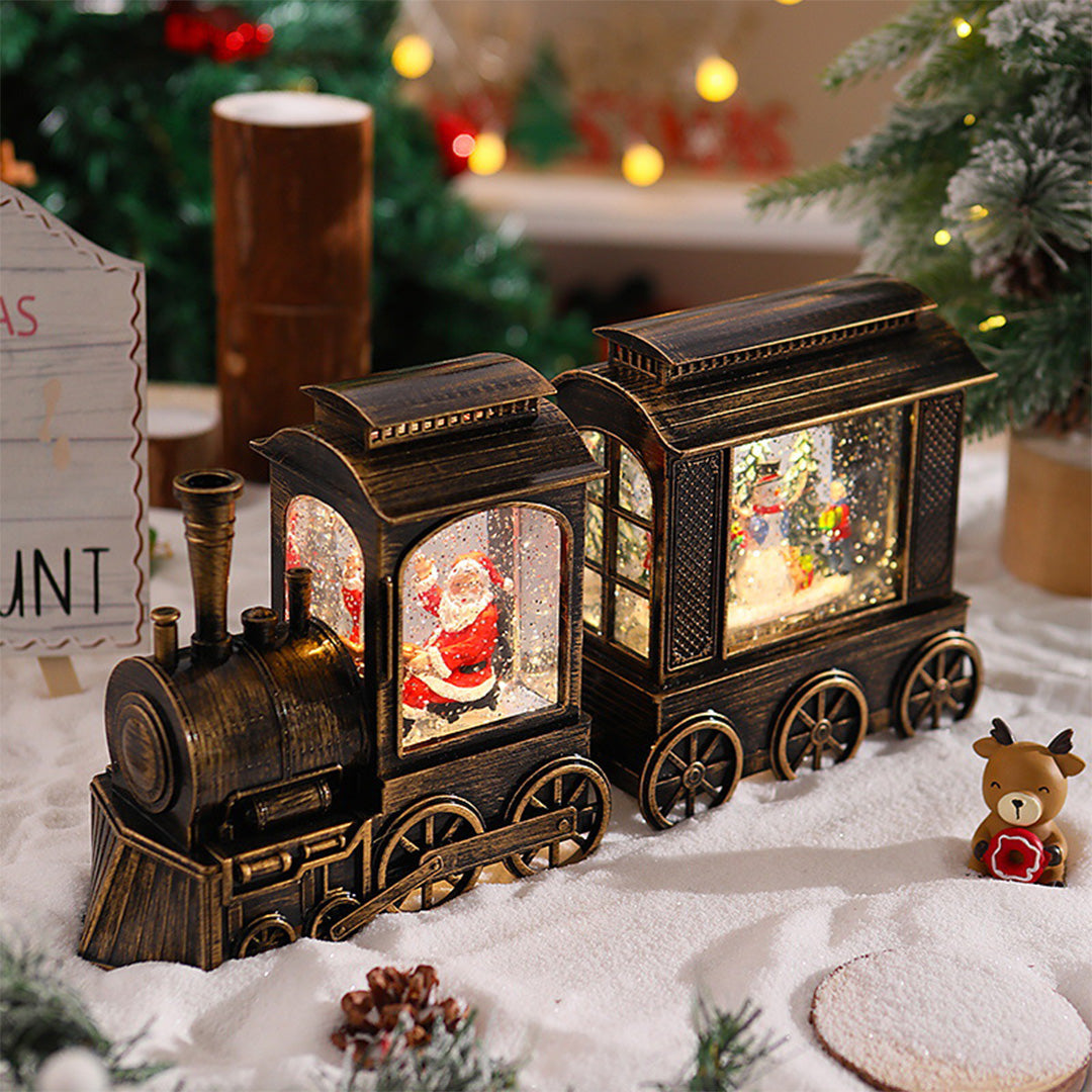 Two-piece Christmas train set with warm interior lighting and holiday decorations.