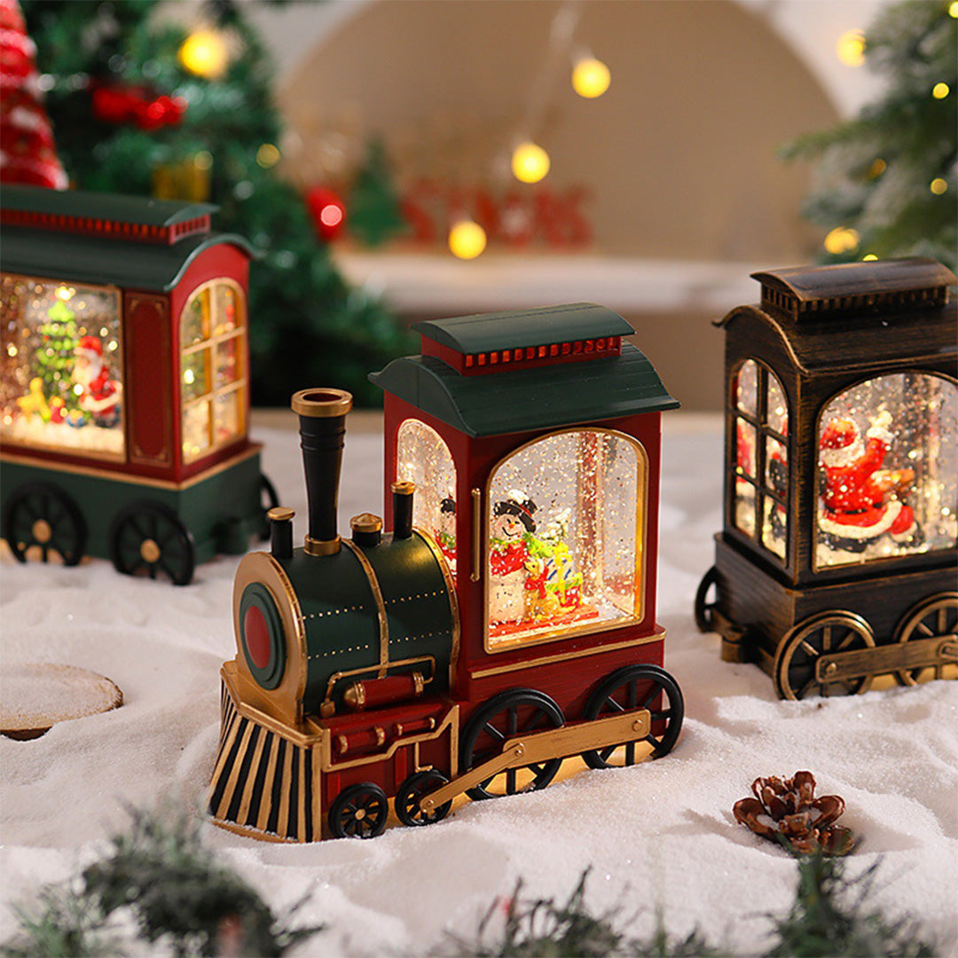Two-piece Christmas train set with warm interior lighting and holiday decorations.
