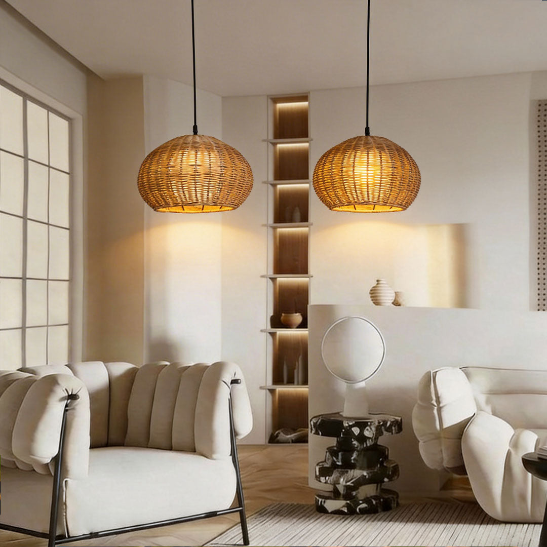 Two rattan outdoor pendant lights hanging above a modern living room sofa with white decor ok!