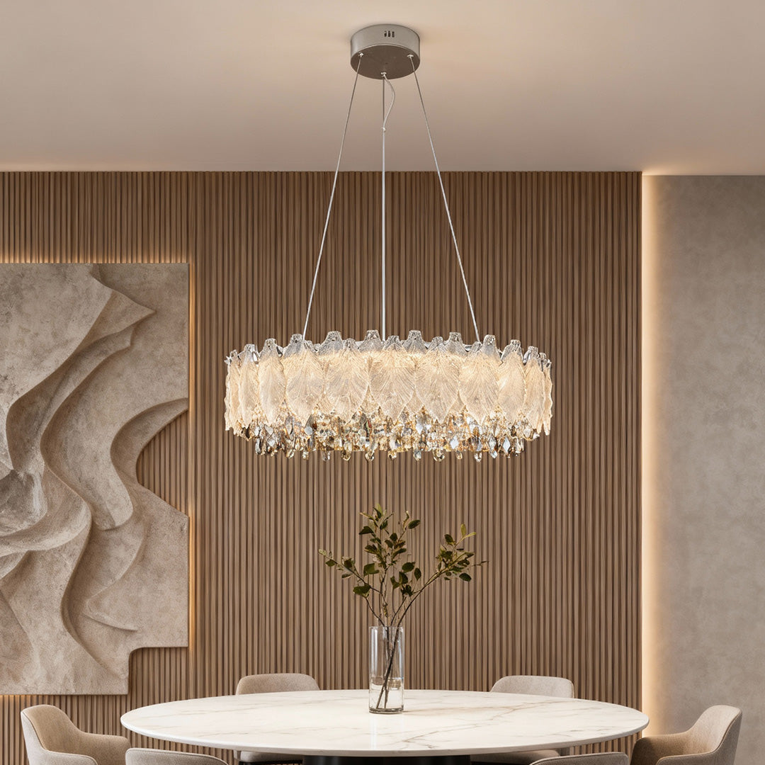 Two-tier French chandelier with gold finish hanging in elegant dining room.