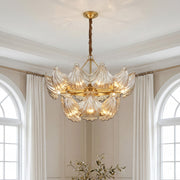 Luxurious two-tiered modern large chandeliers featuring textured glass leaf elements and a gold finish in an elegant room.