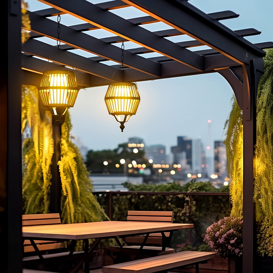 Two tiered japanese lantern pendant light fixtures providing soft ambient light for a patio seating area under a pergola.