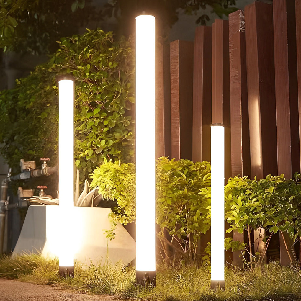 Ube landscape light beside a modern house, creating a sleek and contemporary outdoor look.