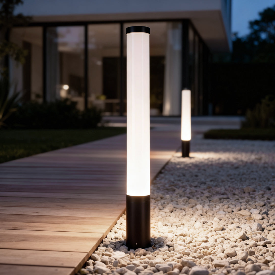 Ube landscape light installed along a wooden deck pathway, enhancing the evening ambiance.