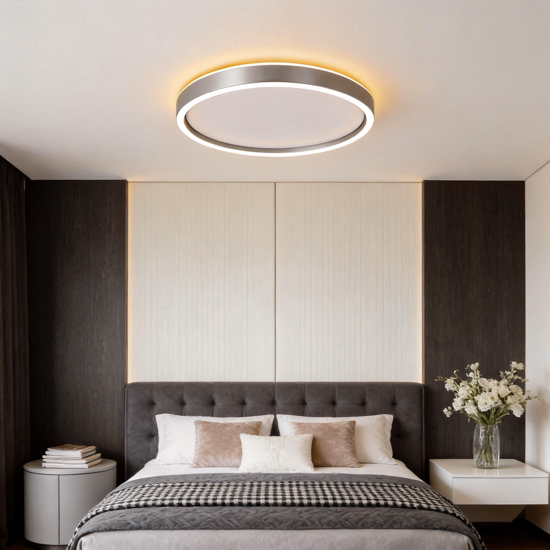 Ultra thin LED ceiling light mounted in a modern bedroom interior.