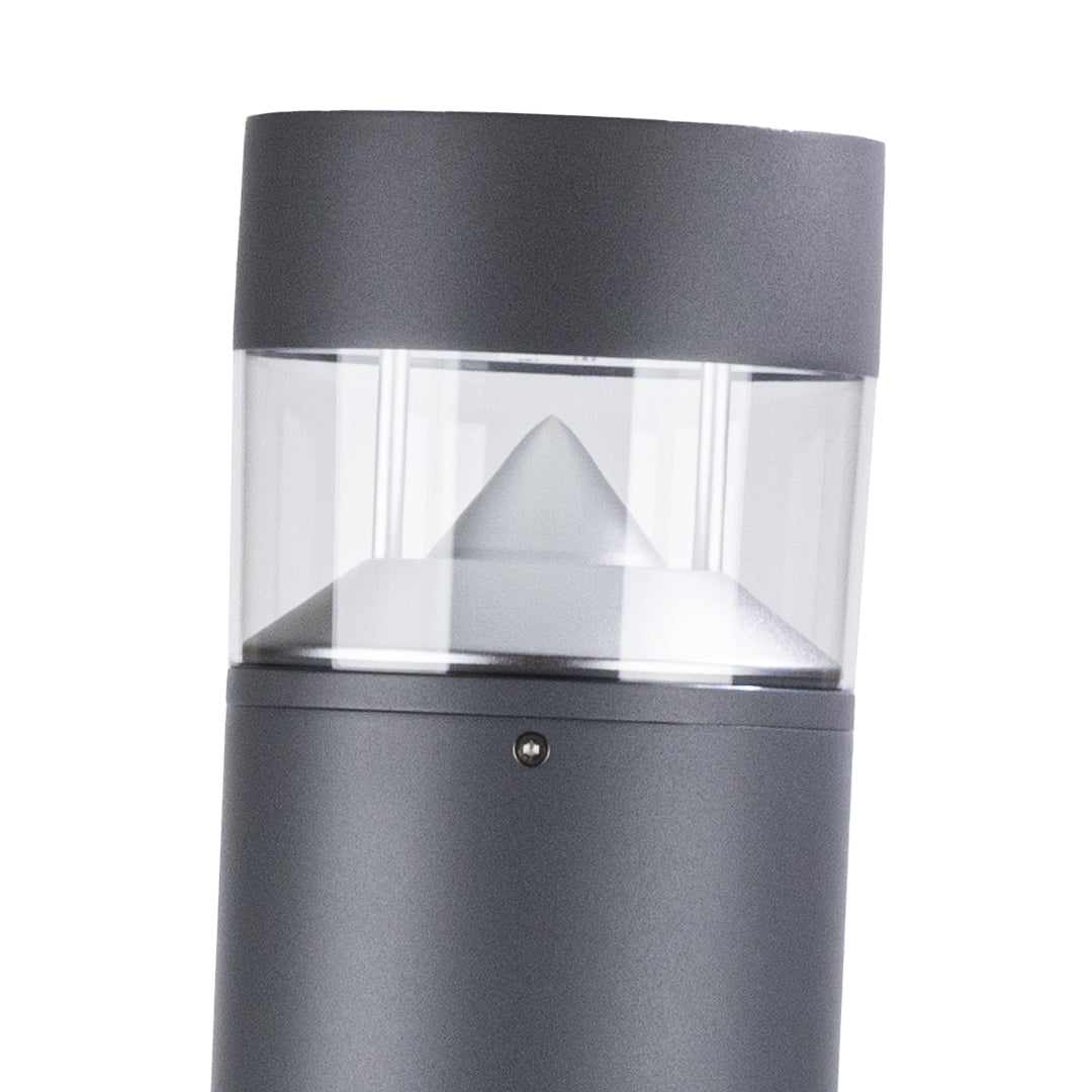 Matching bollard lights creating uniform illumination along landscaped garden border