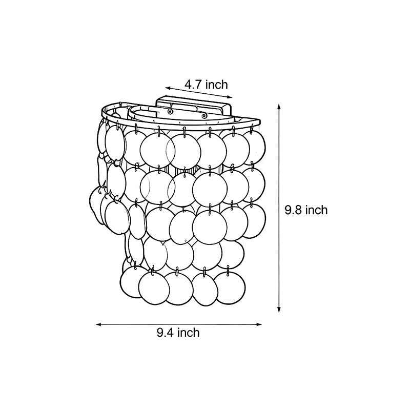 Capiz shell wall sconce with a unique shape, offering soft, atmospheric lighting to enhance home interiors.