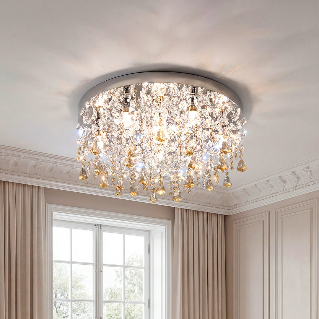 Unique crystal chandeliers with cascading amber and clear droplets on a silver flush mount.