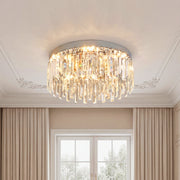 Unique crystal chandeliers with cascading amber and clear droplets on a silver flush mount.