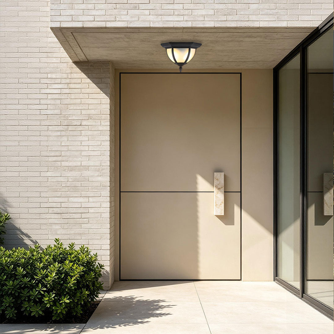 Unique flush mount lighting illuminating a modern front doorway with white brick walls and glass panels.