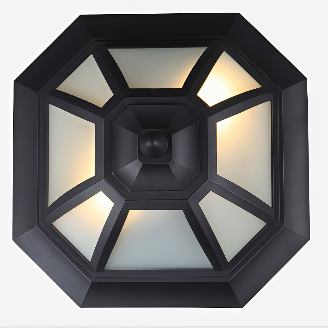 Bottom view of unique flush mount lighting featuring an octagonal black frame and geometric glass design.