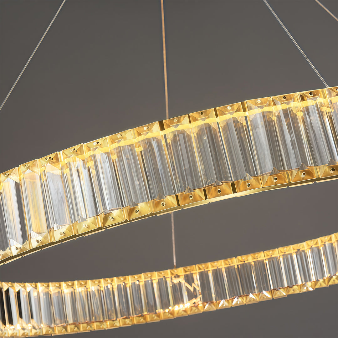 Modern luxury chandeliers close-up showcasing brass frame and crystal glass rod detail
