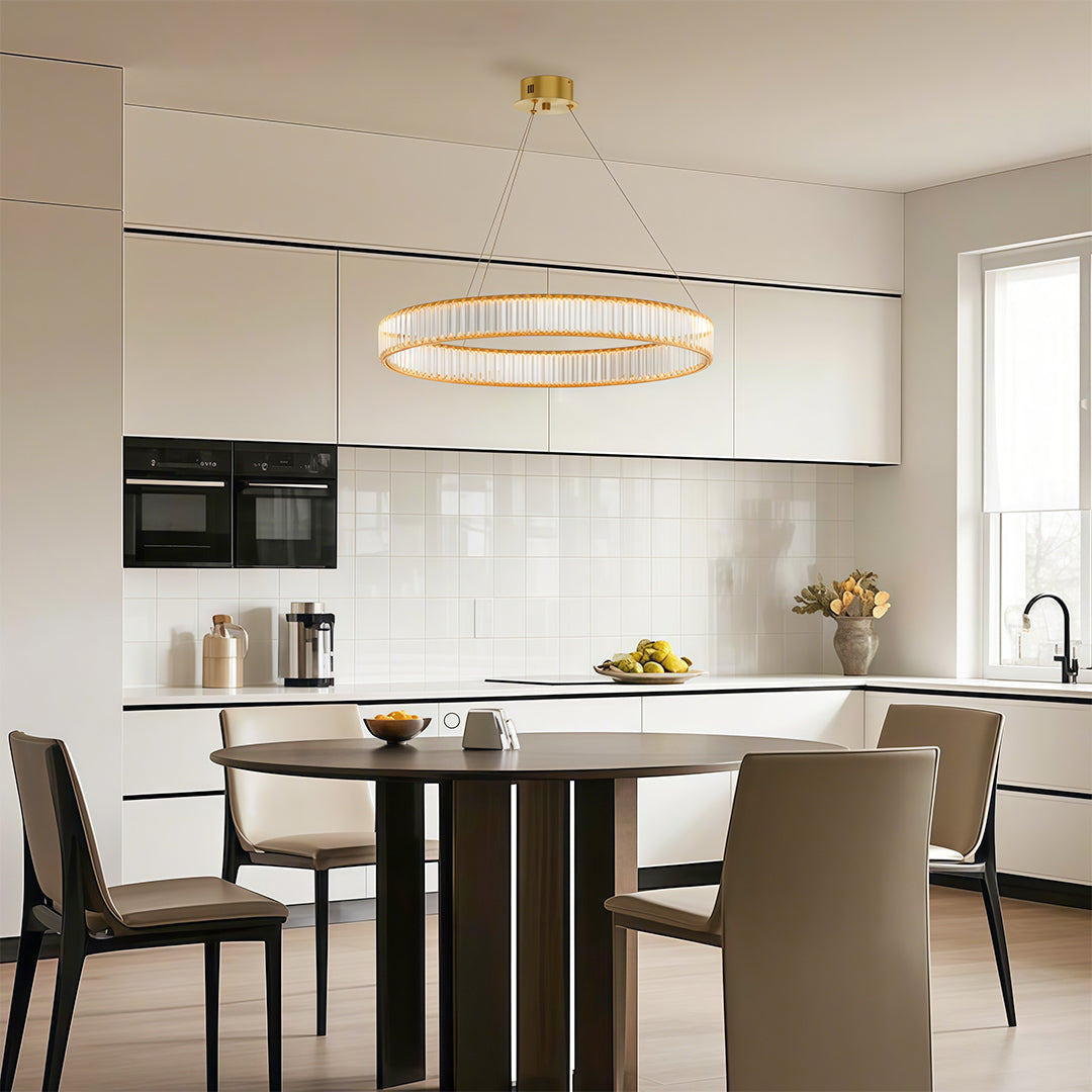 Unique modern chandeliers in contemporary kitchen dining area with white cabinetry