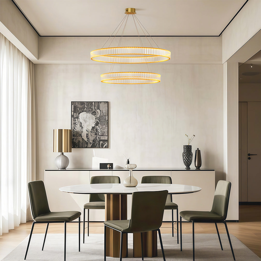 Modern luxury chandeliers lighting minimalist dining space with white walls and modern chairs